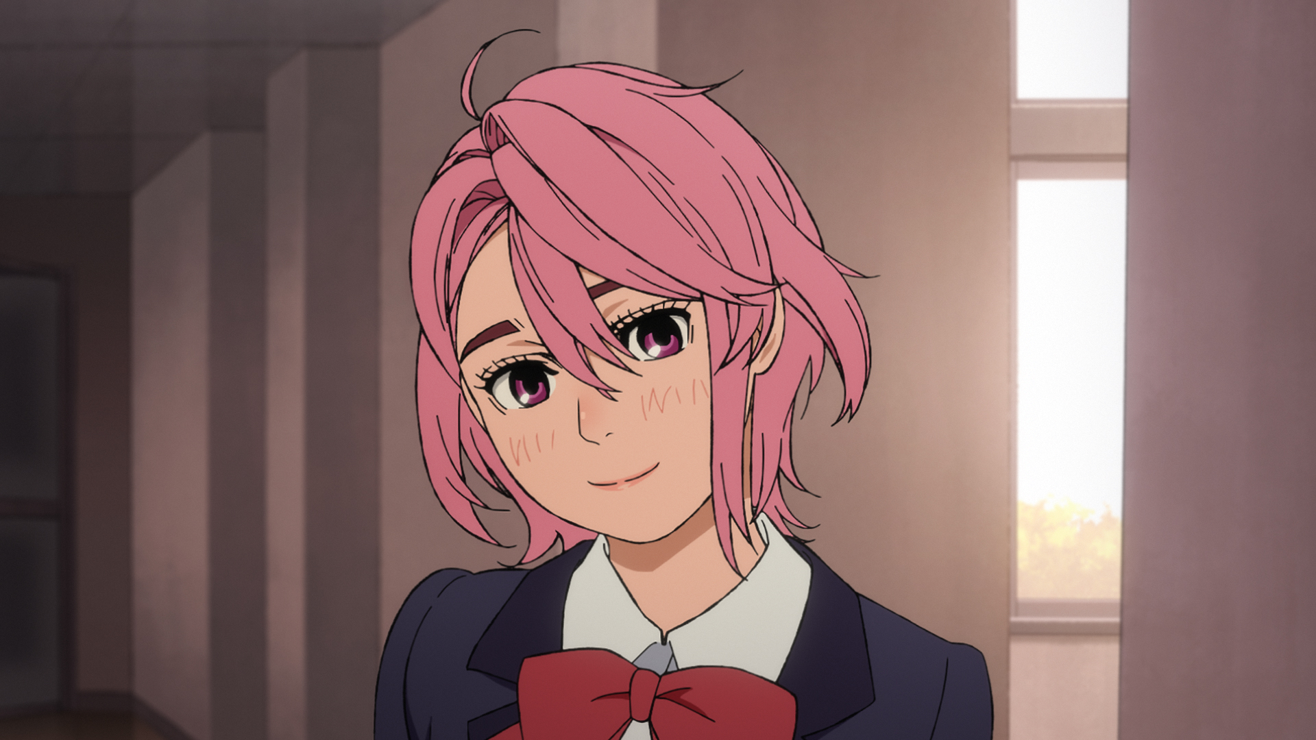Aira smiles in her school uniform.